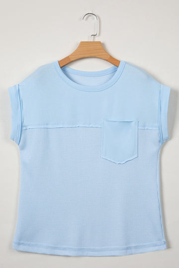 Women's light blue block colour sweater styled with white trousers — colour pairing guide by eAura