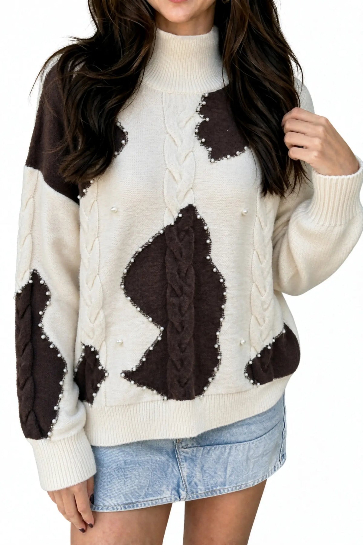 Beige cable knit mock neck sweater with beaded western details
