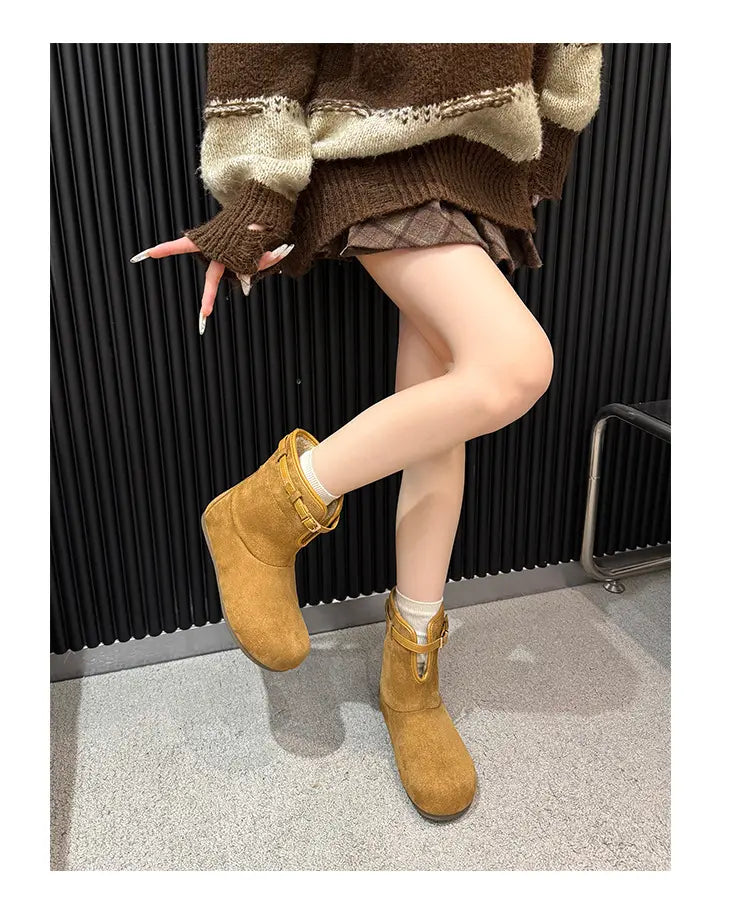 Camel fleece-lined ankle boots worn with cuffs upright