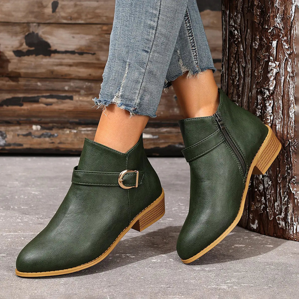 Green ankle boots showing low block heel