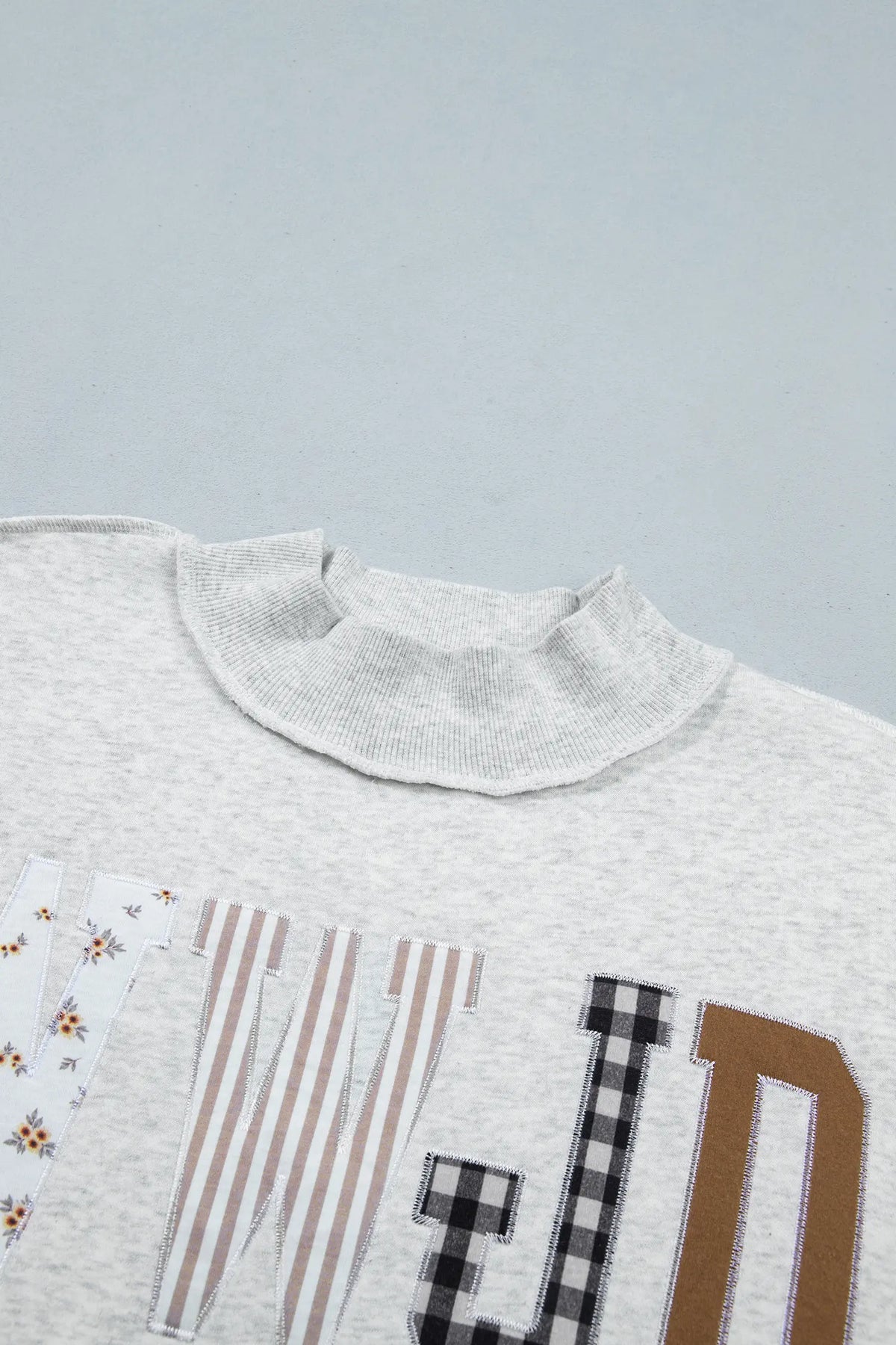 WWJD Mixed Pattern Embroidered Patch Graphic Mock Neck Sweatshirt – Grey