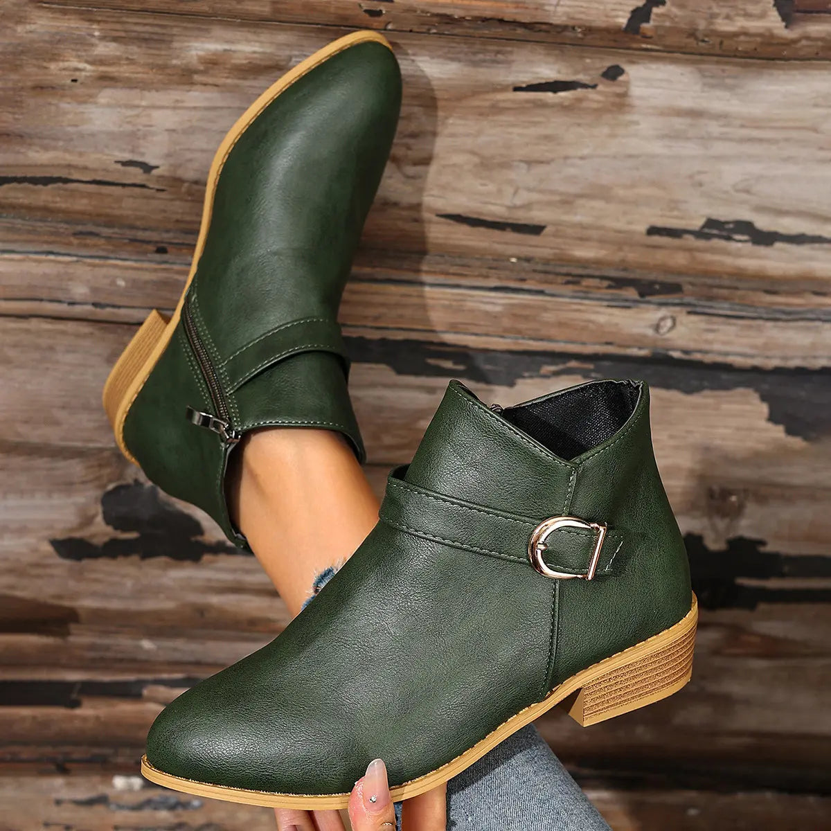 Green buckle boots, hand-held view