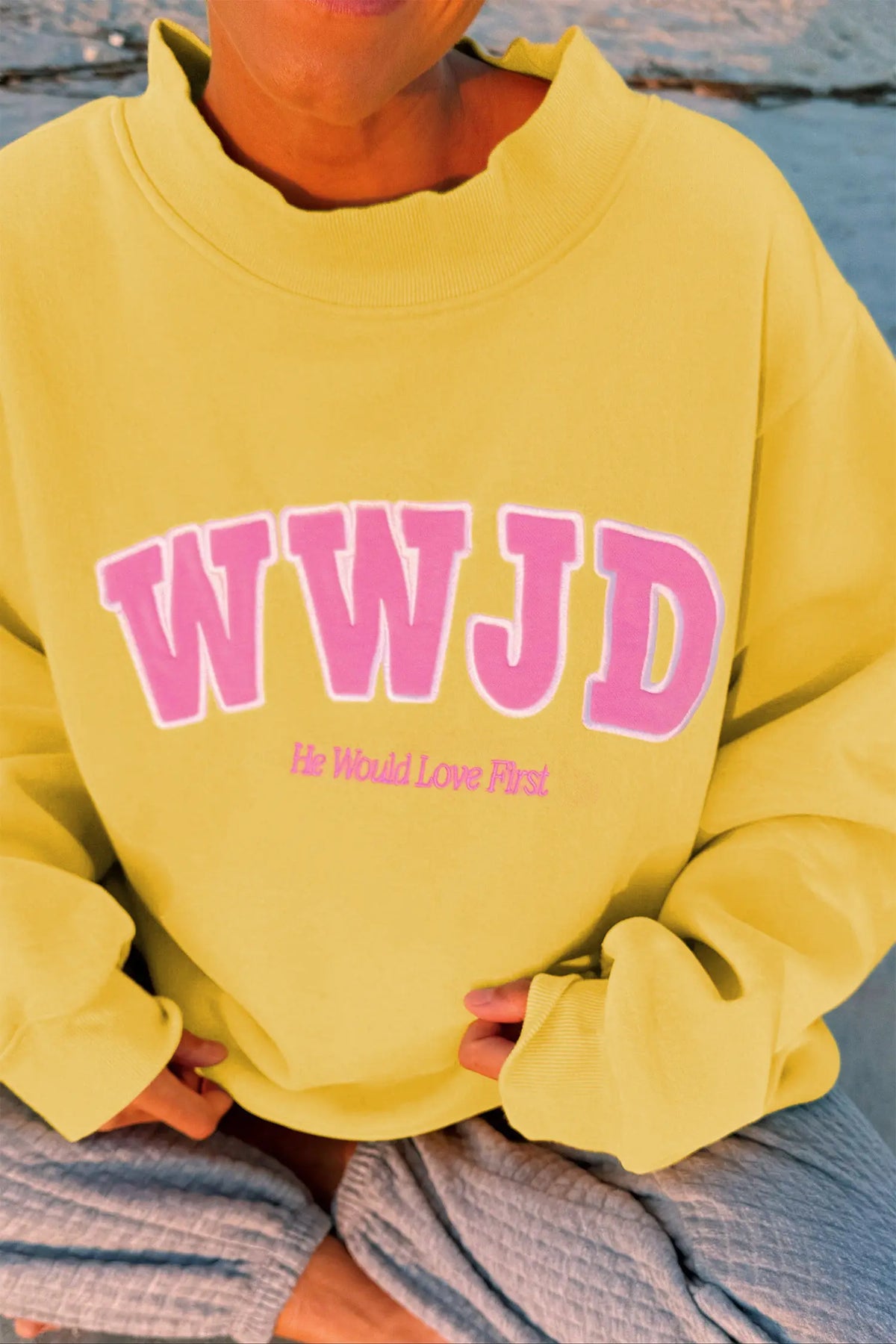 WWJD embroidered long-sleeve sweatshirt with ribbed neckline, cuffs and hem