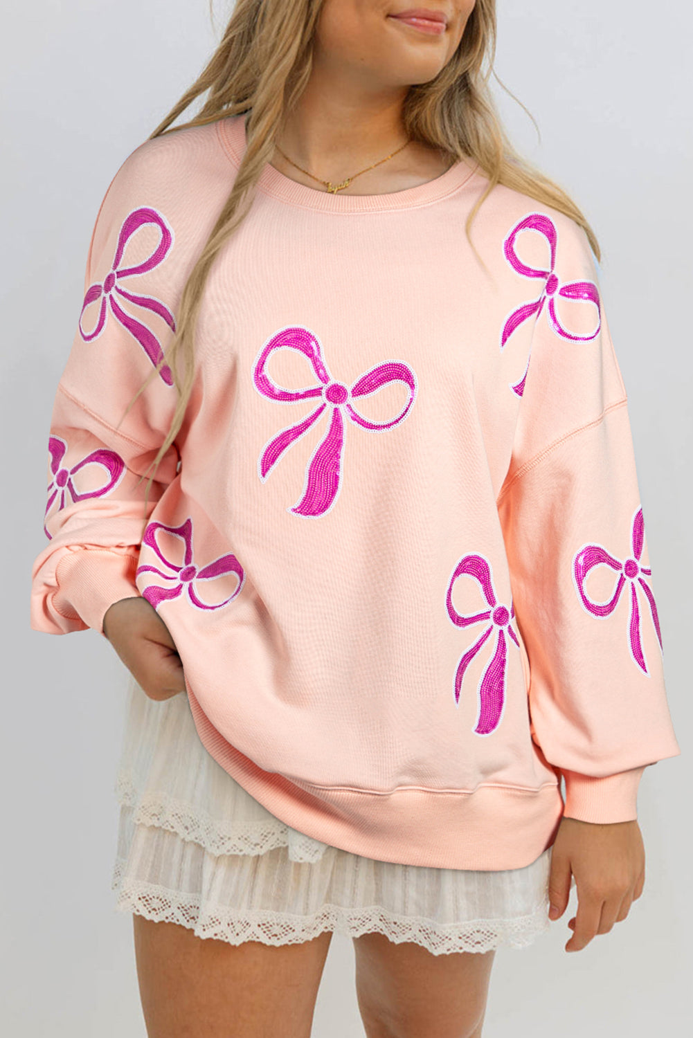 Apricot Pink Sequined Bowknot Drop Shoulder Oversized Sweatshirt - eAura