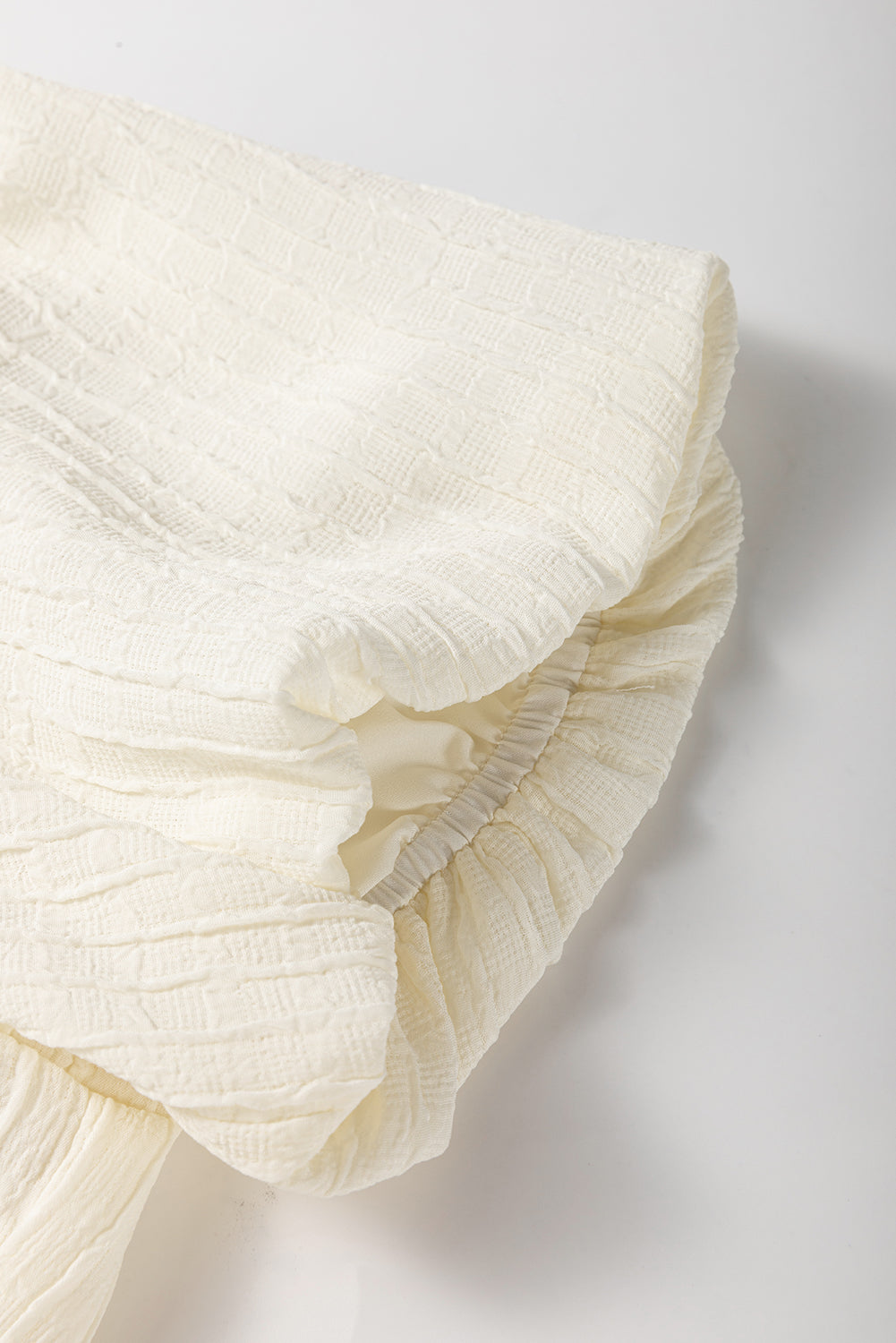 White Textured Bow Ties Front Bubble Hem Puff Short Sleeve Blouse eAura