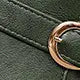 Green boot buckle and upper close-up