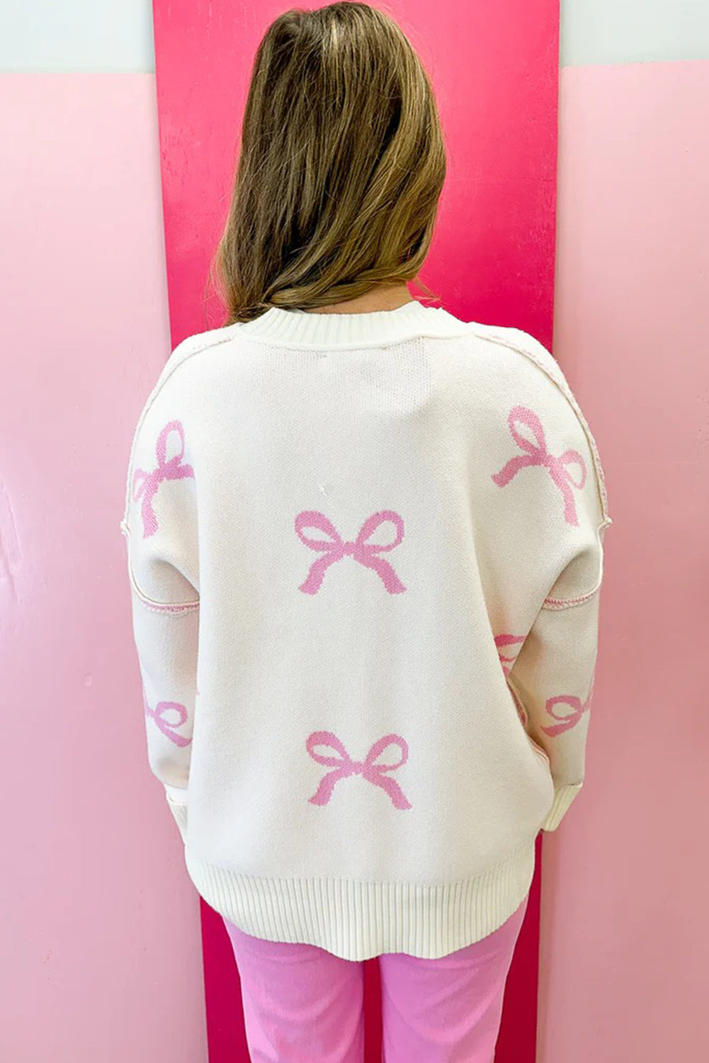 Pink Bow Print Ribbed Trim Exposed Seam Drop Shoulder Loose Sweater eAura