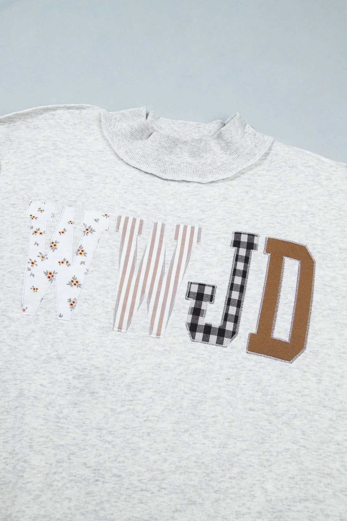 WWJD Mixed Pattern Embroidered Patch Graphic Mock Neck Sweatshirt – Grey