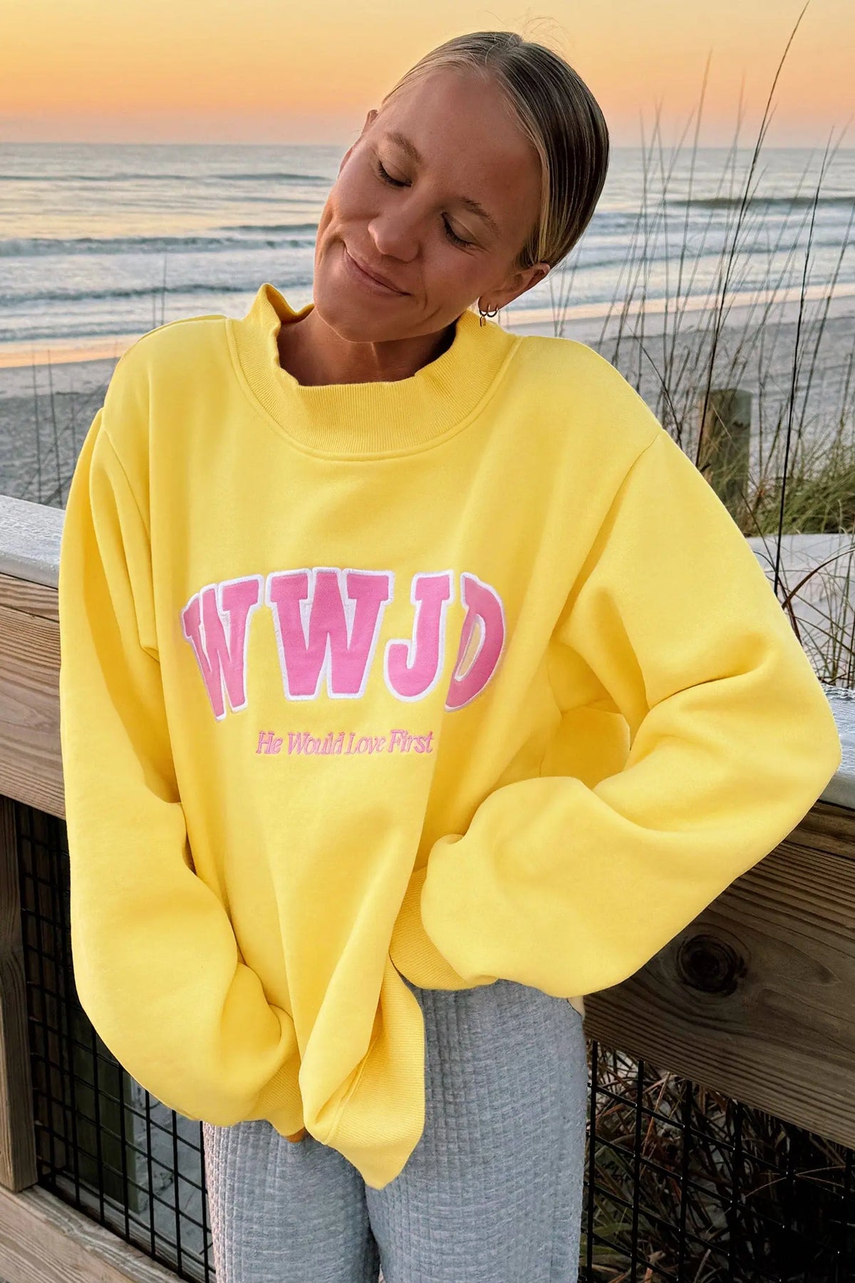 WWJD embroidered long-sleeve sweatshirt with ribbed neckline, cuffs and hem
